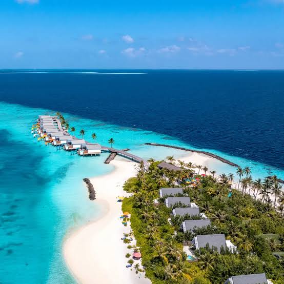 Overwater villas and turquoise lagoon in the Maldives